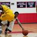 Saginaw High Julian Henderson reaches for a loose ball during the game against Ypsilanti on Tuesday, March 19. Daniel Brenner I AnnArbor.com